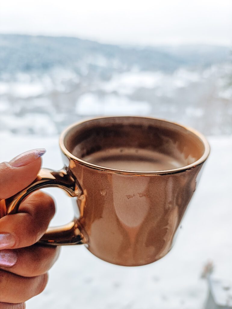 Quiet morning coffee moment by the window during winter